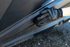 The Rag Company black nitrile gloves pair ready to protect hands during application