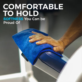 The Rag Company towel held in hand indicating 16x16 size and control