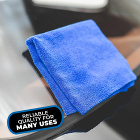 The Rag Company towel next to a hand to show 16x16 size and handling comfort