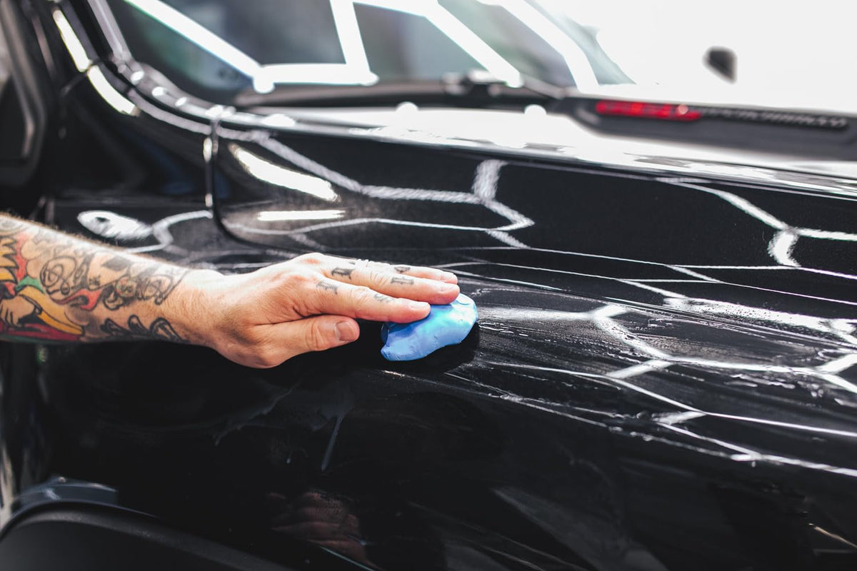 Detailing setup with The Rag Company clay bar highlighting professional prep workflow