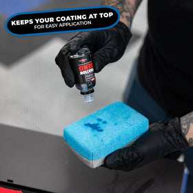 Using The Rag Company applicator to apply tire dressing for precise coverage and minimal waste