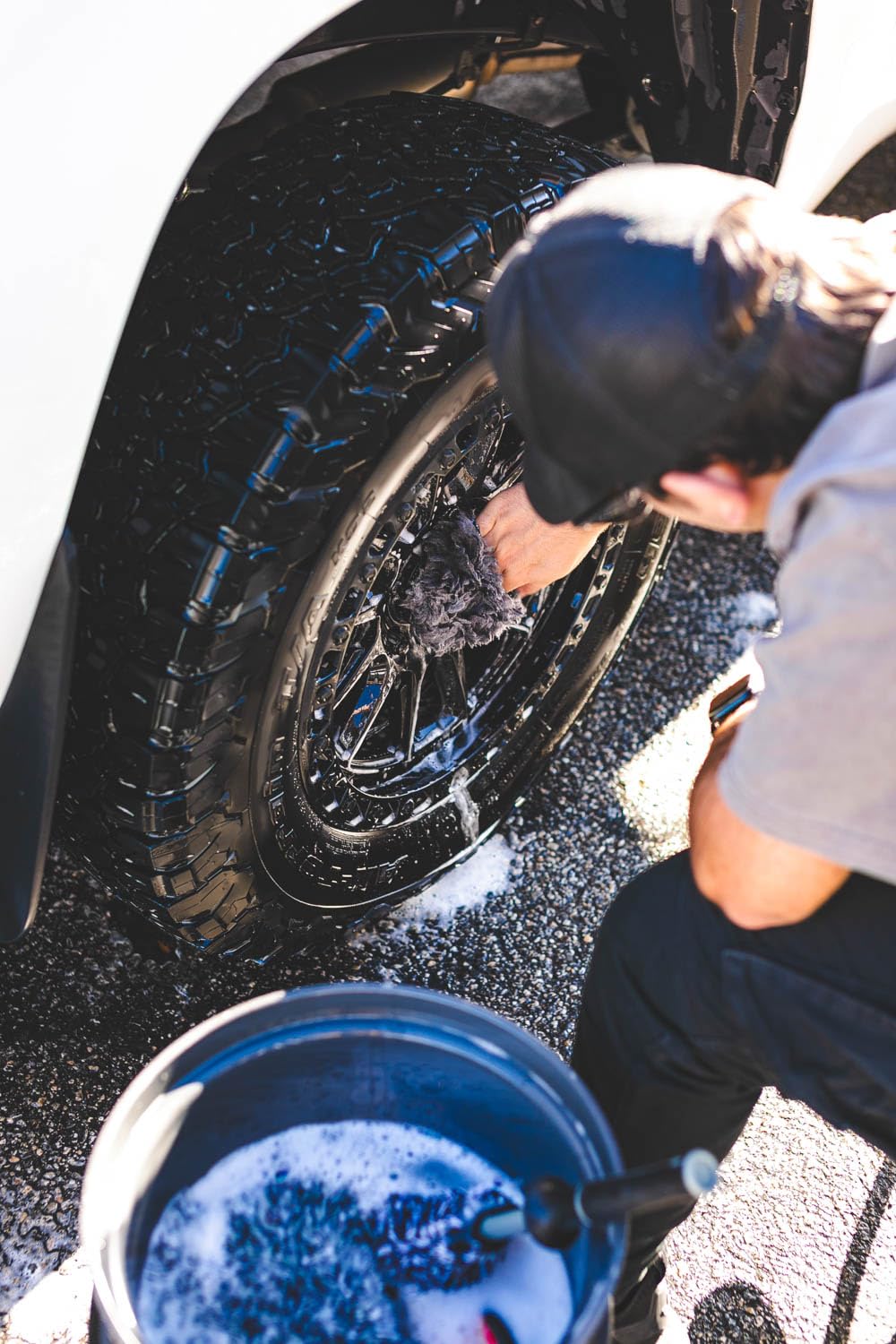 The Rag Company mitt scrubbing wheel spokes lifting brake dust effectively