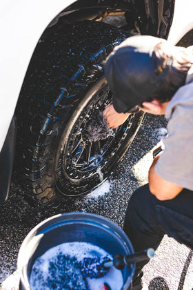 The Rag Company mitt scrubbing wheel spokes lifting brake dust effectively