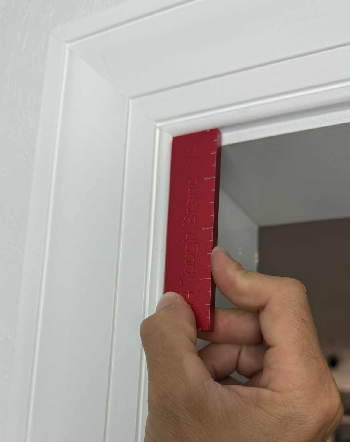 The Tough Brand on a jobsite with tools showing practical use and improved trim alignment