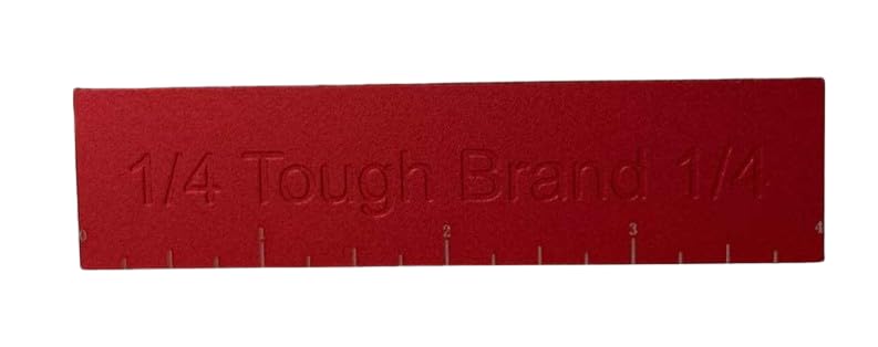 The Tough Brand beside a tape measure illustrating compact size and accurate spacing