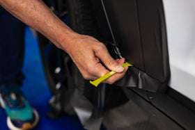 THE WRAP INSTITUTE red thick-edge close-up highlighting pry surface and safe leverage for moldings