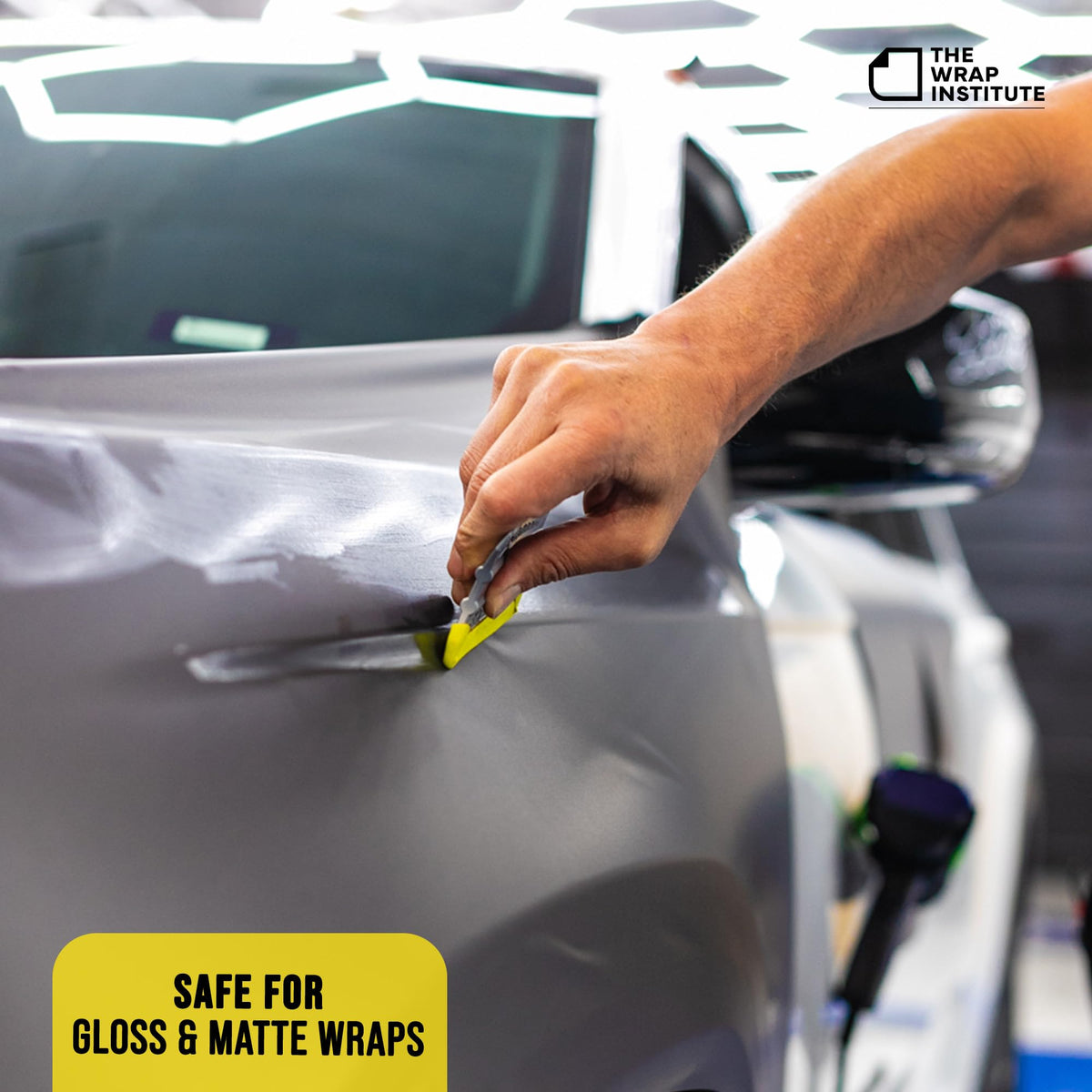 THE WRAP INSTITUTE applying window tint with buffer to prevent marks