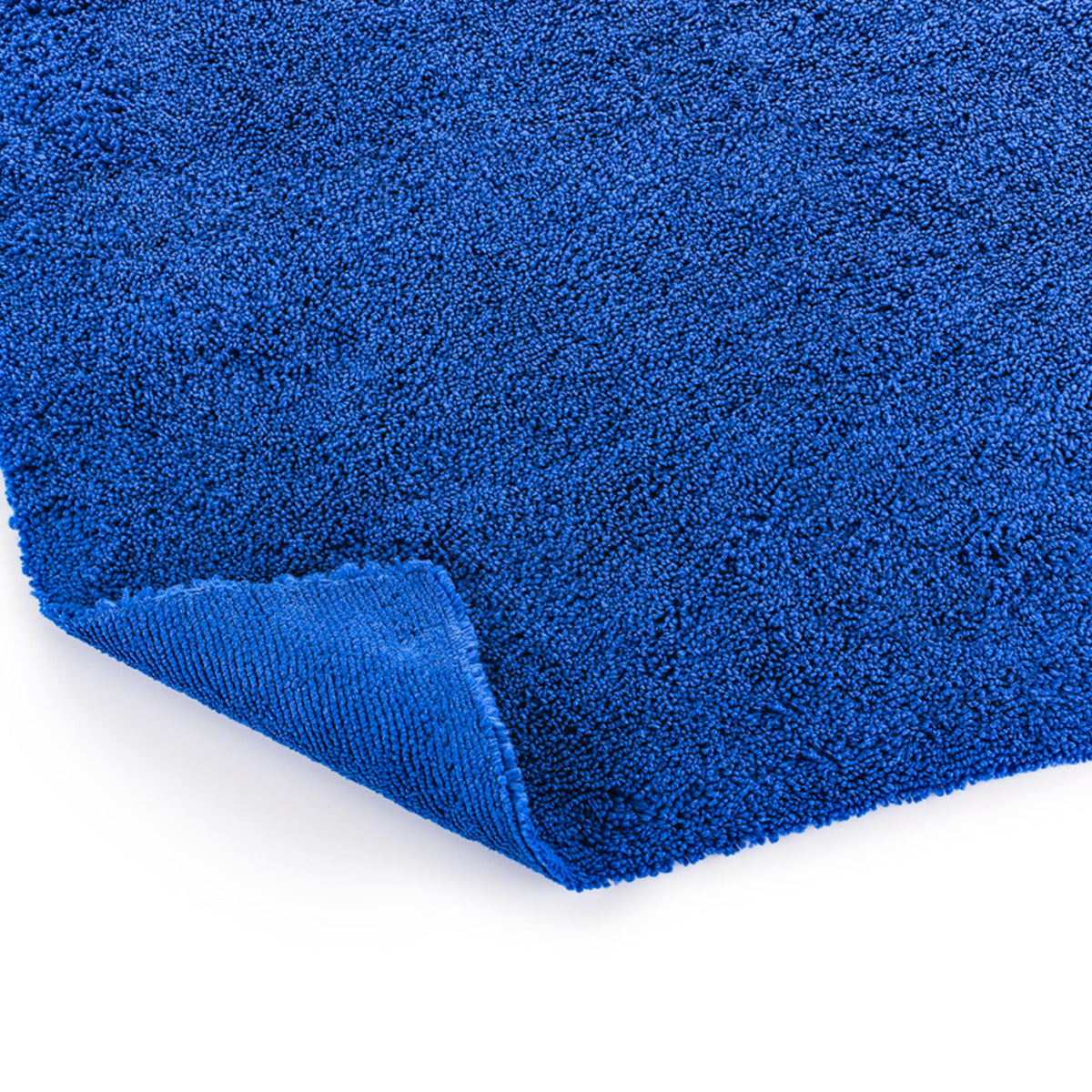 Stack of neatly folded The Rag Company towels illustrating organized storage and durability benefit