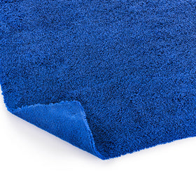 Stack of neatly folded The Rag Company towels illustrating organized storage and durability benefit