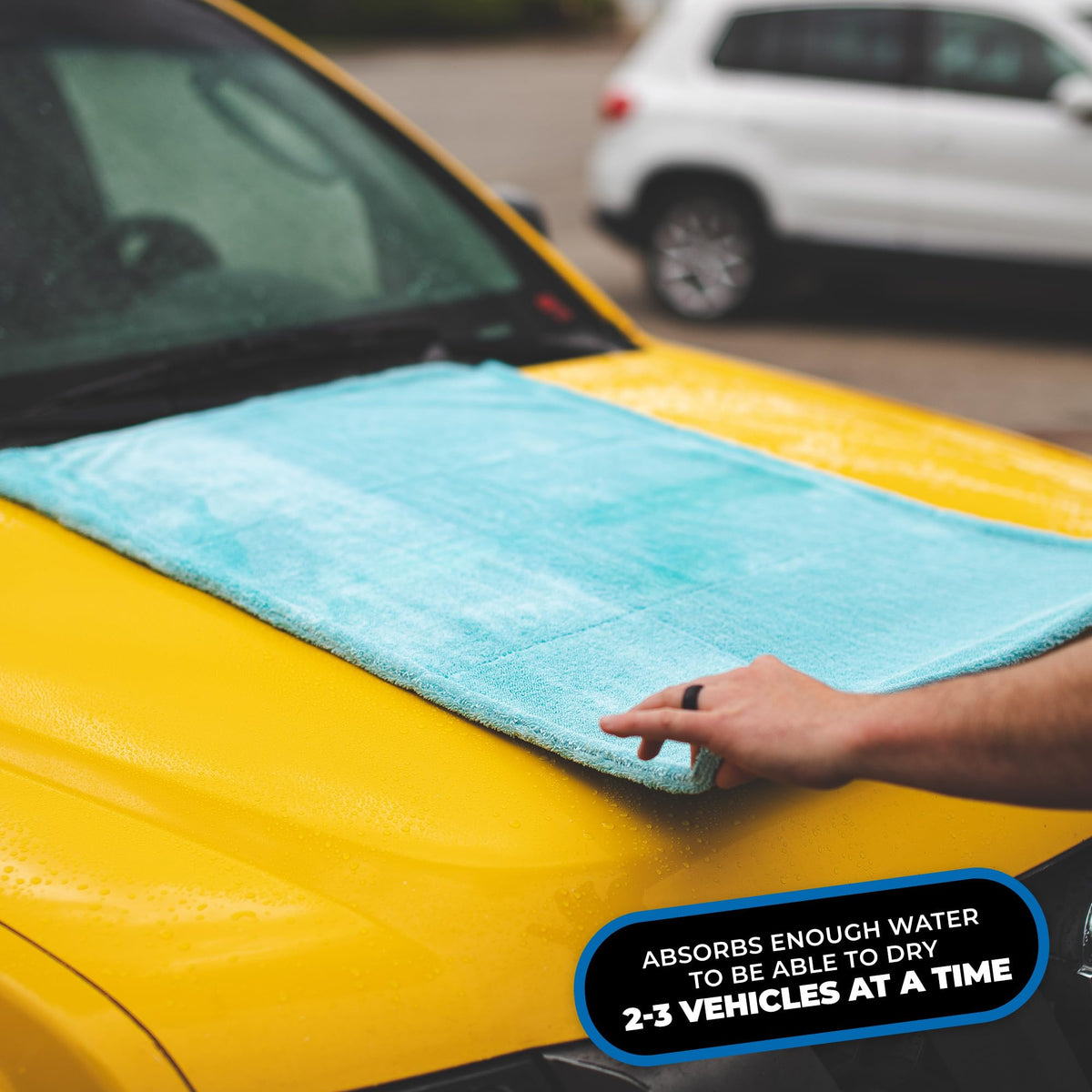 The Rag Company towel drying a car door showing safe, scratch-free water removal