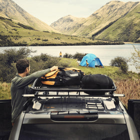 Thule Canyon XT mounted on SUV demonstrating added storage and secure carry