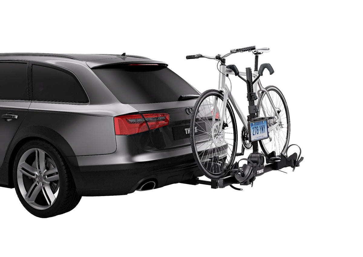 Thule license plate holder strap close-up showing adjustable fit and secure mounting benefit