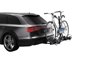 Thule license plate holder strap close-up showing adjustable fit and secure mounting benefit