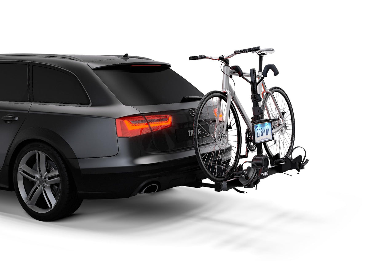 Thule license plate holder rotated between stowed and in-use positions showing convenience benefit