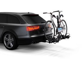 Thule license plate holder rotated between stowed and in-use positions showing convenience benefit