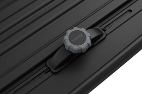 Thule Pulse 2 L next to suitcases illustrating 16 cu ft capacity