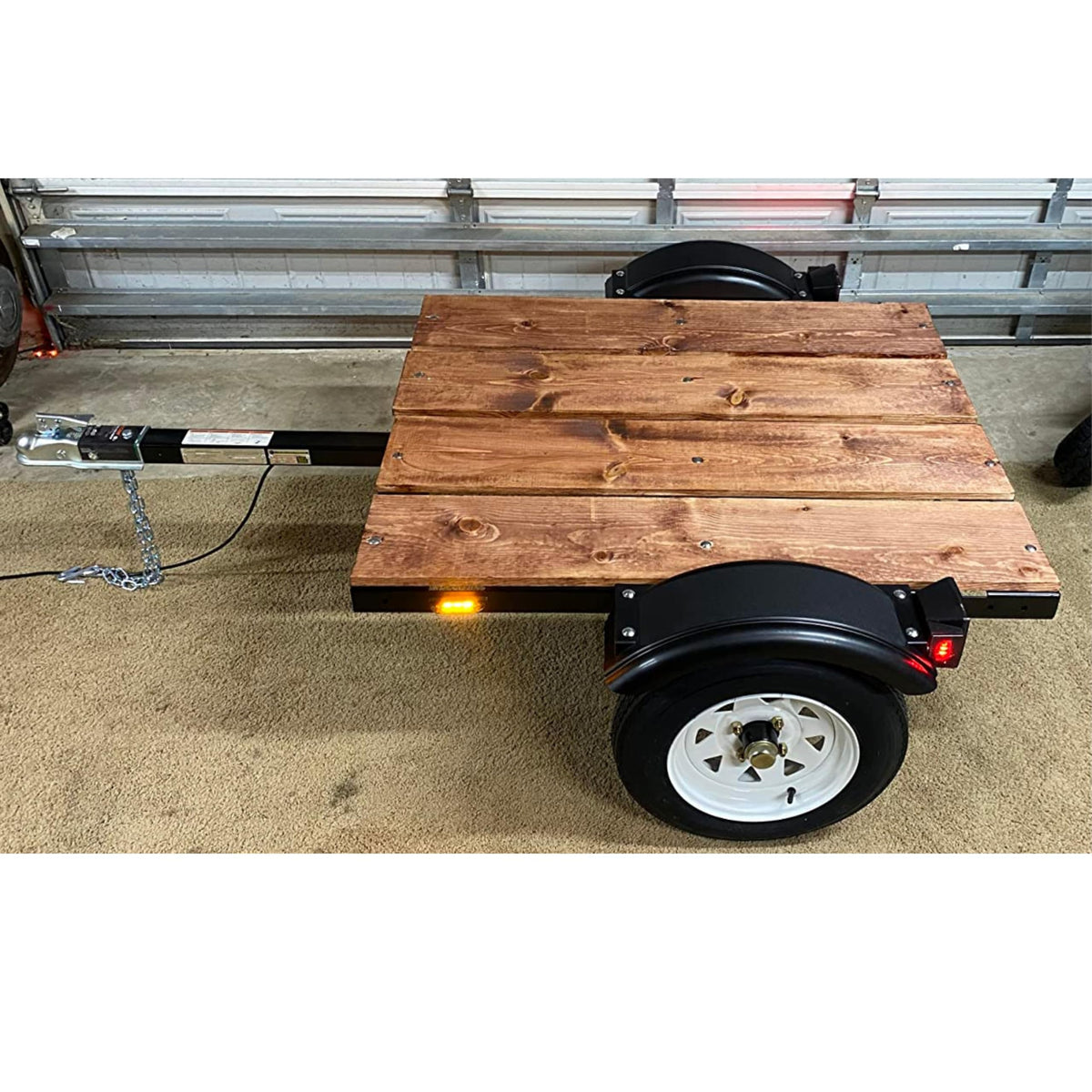 Tie Down installed on trailer showing debris protection in use