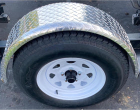 Tie Down installed on trailer in use showing durable protection on road
