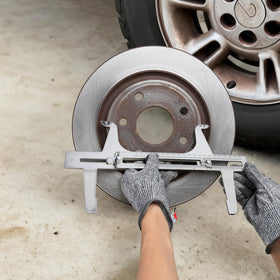 Tlence on a workbench in use illustrating quick, repeatable brake adjustments