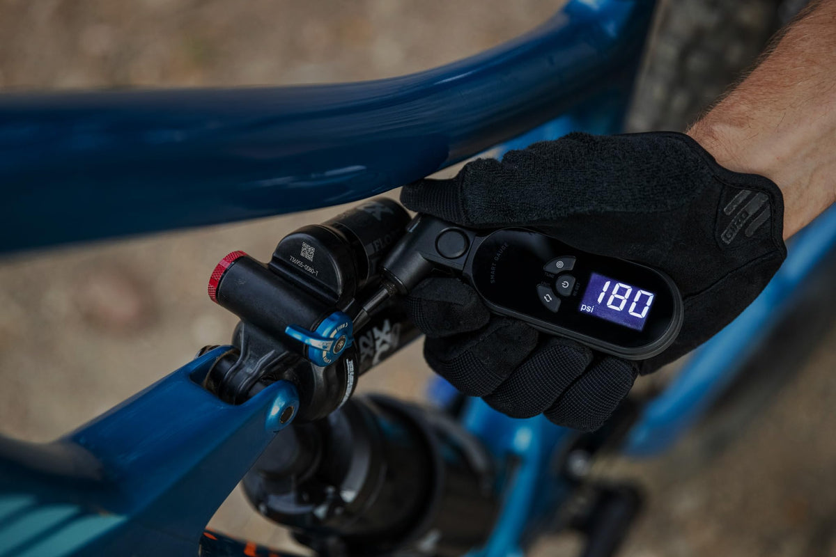 Topeak SmartGauge D2X in use on a bike tire enabling precise pressure adjustments