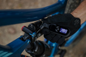 Topeak SmartGauge D2X in use on a bike tire enabling precise pressure adjustments