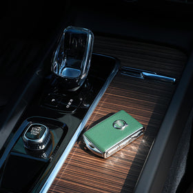 TOUPHY cover next to original Volvo key showing precise fit and size comparison
