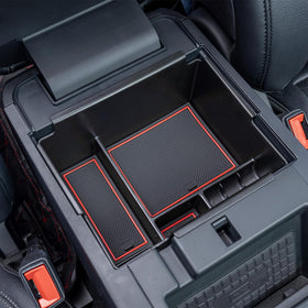 TOPINSTALL lifestyle shot driver reaching into organizer for safe quick access