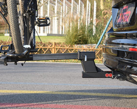 TOPTOW installed on vehicle rear with bike rack showing improved clearance