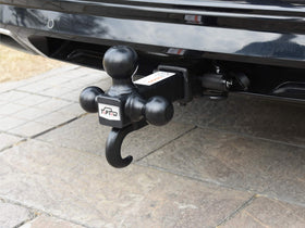 TOPTOW mounted towing a trailer on highway, shows real-world performance