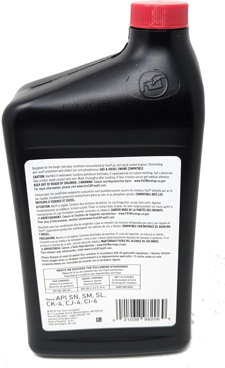 Toro 32oz bottle being poured into engine with scale showing easy measurement benefit