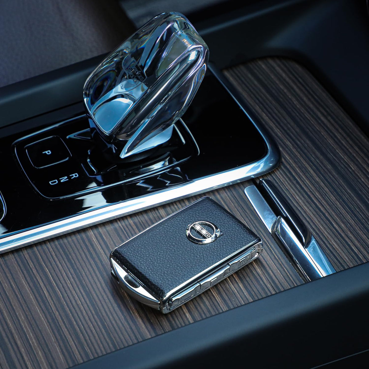 TOUPHY key fob placed by Volvo door handle conveying stylish upgrade