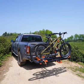 Towever attached to bike rack demonstrating secure load support