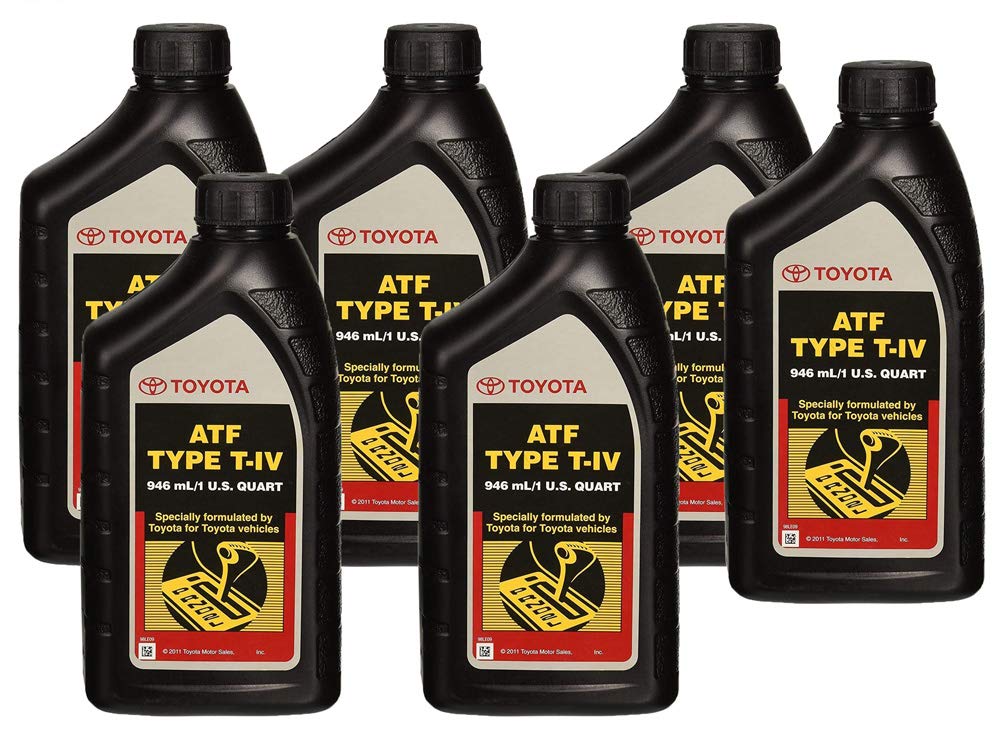 Toyota automatic transmission fluid pouring into a funnel, illustrating clean transfer and reduced contamination risk