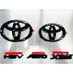 Toyota blackout emblem overlay front badge showing sleek black finish and refined look