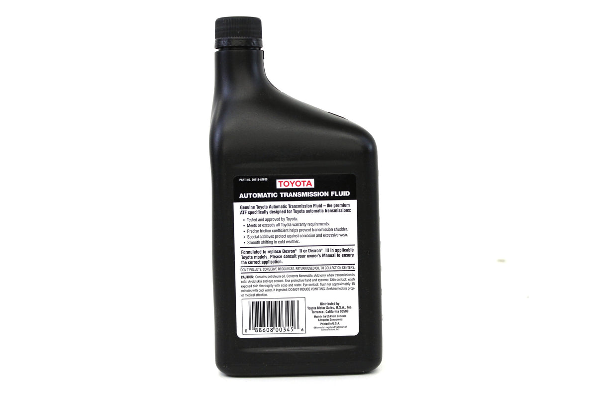 Toyota Genuine Fluid 00718ATF00 pouring into transmission with measurable quart scale for accurate topping