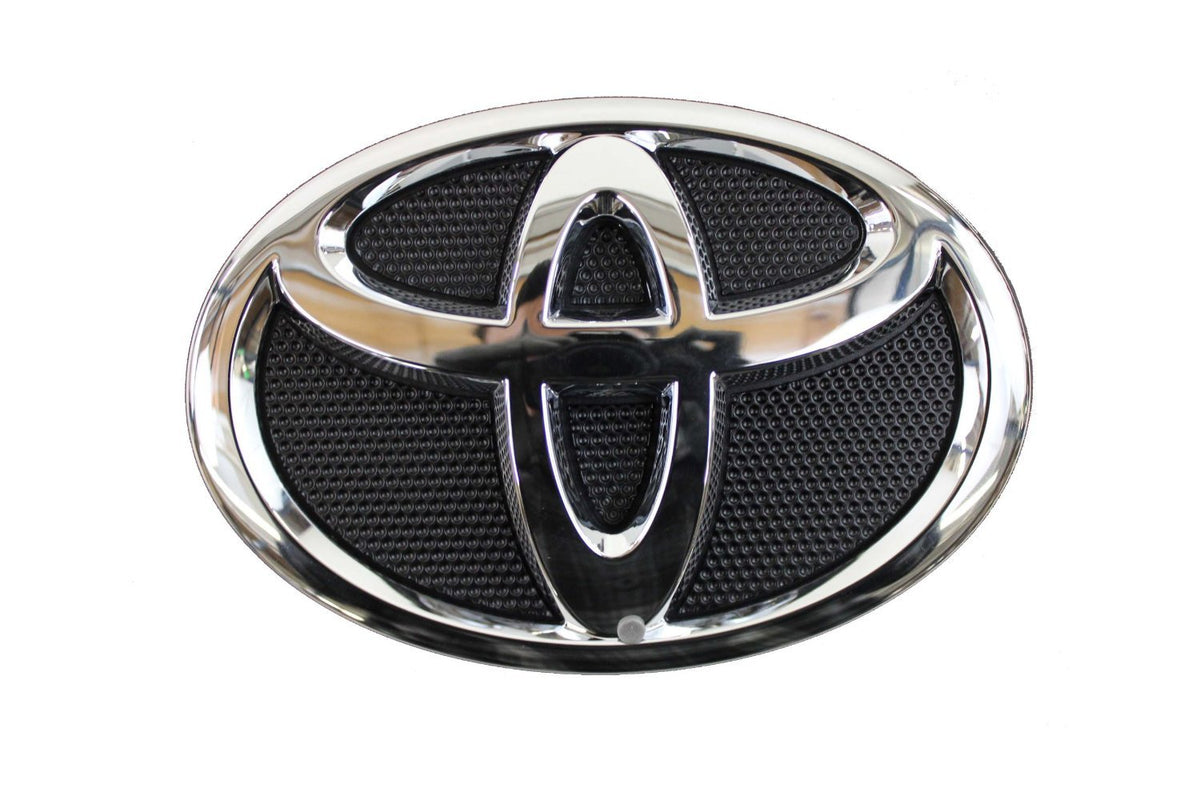 Toyota genuine grille emblem front view restores factory look