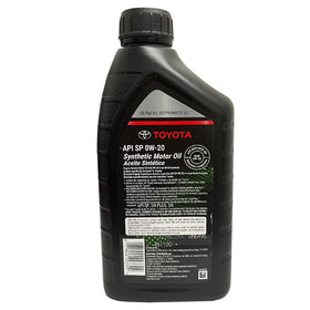 Toyota oil beside a ruler and filter for scale, displays correct 4-quart service quantity
