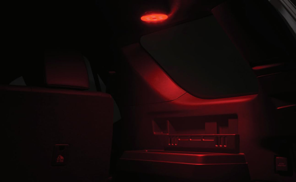 Toyota side storage LED lantern in use at night with bright light aiding roadside tasks