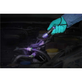 TRACER dye fluorescing under UV lamp on A/C hose, reveals leak locations quickly