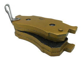 Traild brake pad beside ruler highlighting pad thickness and longer lifespan compared to stock pads
