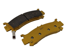 Traild pads beside a ruler for size comparison and correct fitment