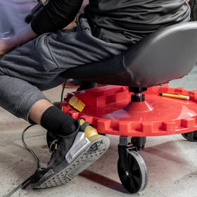 Traxion next to standard stool showing larger capacity and stability