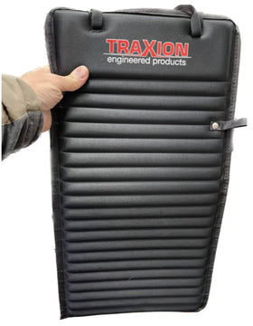 Traxion Versa Mat Mini front view showing full 12 by 24 inch pad protecting a workbench