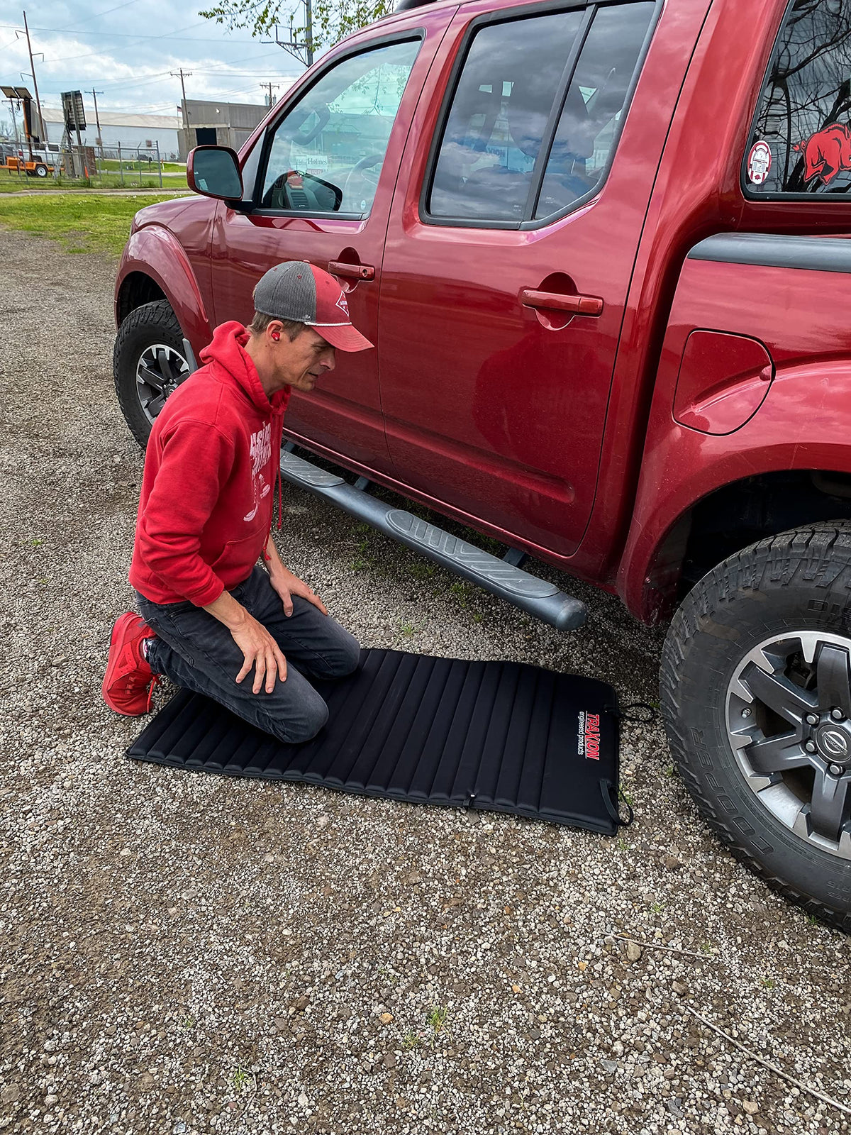 Traxion VersaMat beside tools showing size comparison and stable coverage benefit