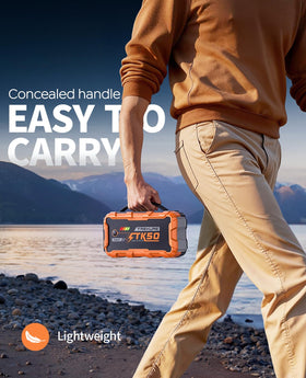 TREKURE jump starter connected to car battery restarting engine quickly