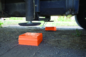 Tri-Lynx pack storage shown with hands for scale to demonstrate compact, travel-friendly size