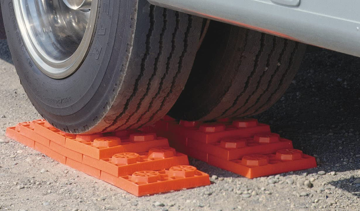 Tri-Lynx stacked pyramid under RV wheel providing level support benefit