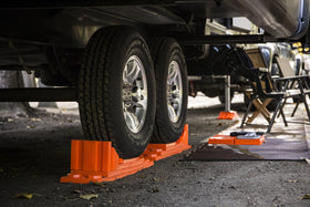 Tri-Lynx Stop N' Chock wheel chocks pair placed side by side to highlight reliable wheel restraint