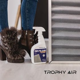 Trophy Air 32 oz bottle next to HVAC filter to show size and practical scale