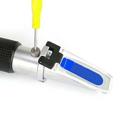 TRZ handheld next to a wrench showing compact size and portability benefit